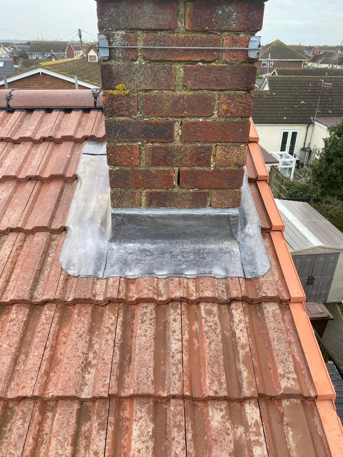 Lead flashing repair around a chimney completed by Goldway Roofing